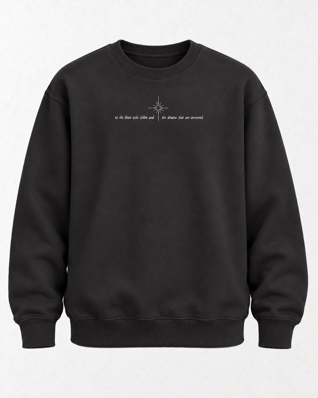 Sudadera negra con una estrella y la frase to the stars who listen and the dreams that are answered